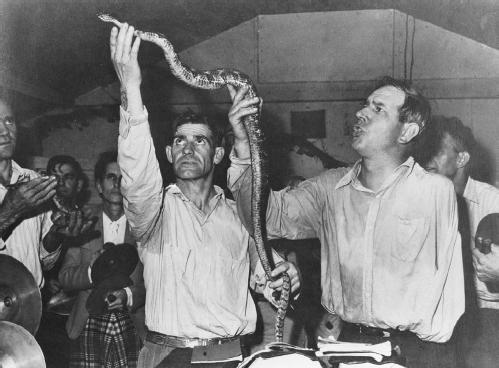 According to the gospel of Mark believers "shall take up serpents; and if they drink any deadly thing, it shall not hurt them." It is believed in some southern American Pentecostal churches that if a person truly has the Holy Spirit within them, they should be able to handle rattlesnakes and other venomous serpents. Snake handling is used as a test or demonstration of faith. (NATIONAL ARCHIVES AND RECORDS ADMINISTRATION)