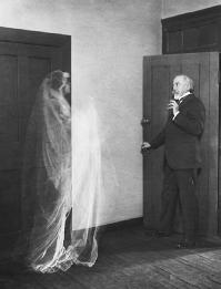Ghost image of a woman frightening an elderly man in a double exposed film from ca. 1910. (CORBIS CORPORATION)